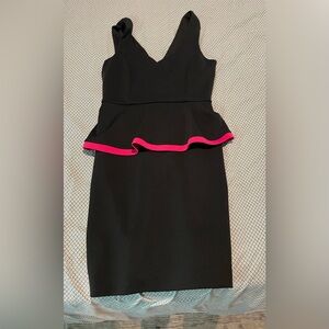Black sleeveless dress with hot pink outlined peplum skirt